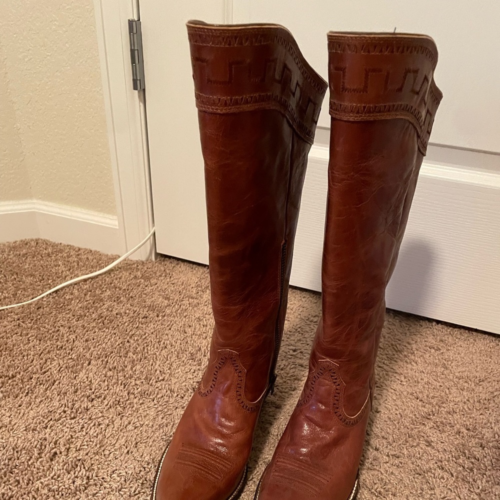 Women’s size 7 Ariat knee-high cowboy boots.